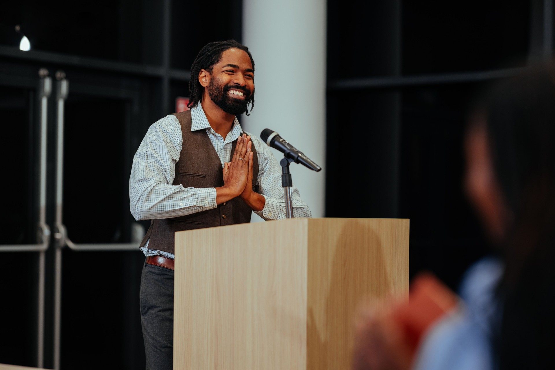 Motivational speaker inspiring audience with engaging presentation
